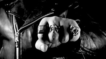 biker wearing rings on fingers