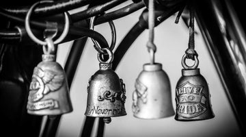 four gremlin bells hanging on motorcycle
