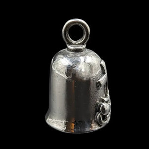 silver gremlin bell with motorcycle and cross