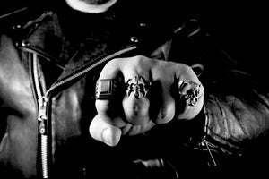 biker wearing rings on fingers