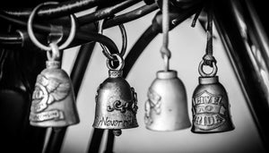 four gremlin bells hanging on motorcycle