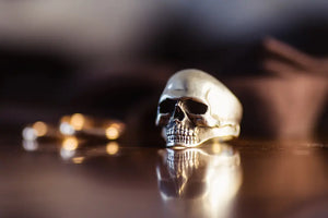 skull ring on table