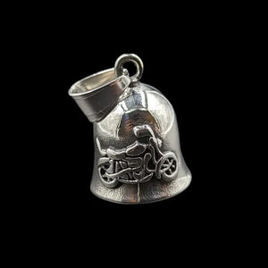 silver gremlin bell with motorcycle