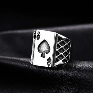silver ring with ace of spades card