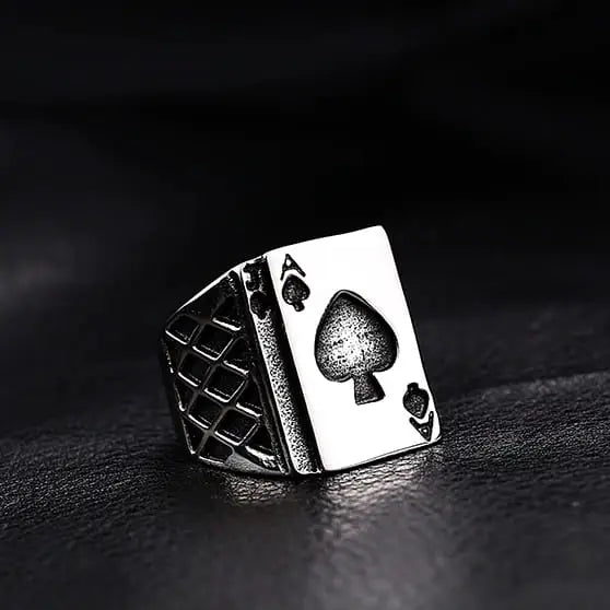 silver ring with ace of spades card