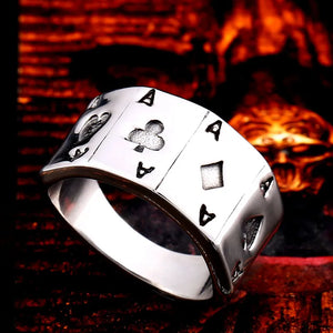 silver ring with four ace of spade cards