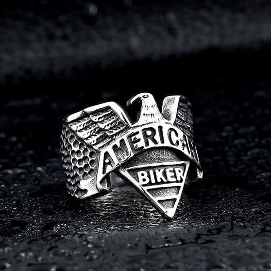 silver biker ring with eagle and text that says american biker