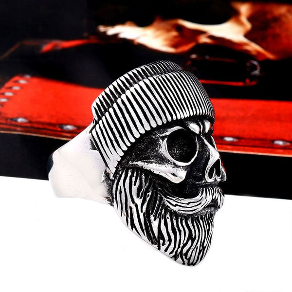 silver skull ring of biker with beanie and beard