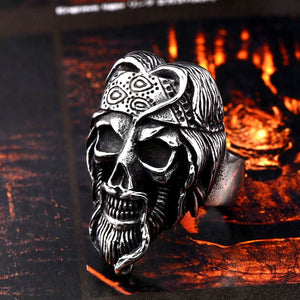 silver skull ring of a biker with headband and beard