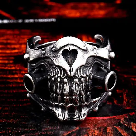 silver ring with lower half of mechanical skull