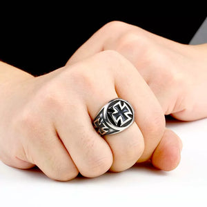 silver ring with biker cross on front and sides worn on finger