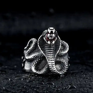 silver ring with egyptian cobra and red jewel in mouth
