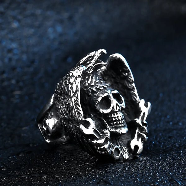 silver ring with eagle wrapping wings around a skull with wrenches