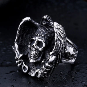 silver ring with eagle wrapping wings around a skull with wrenches