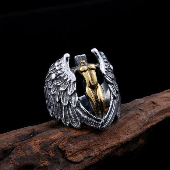 silver and gold ring of headless angel with wings
