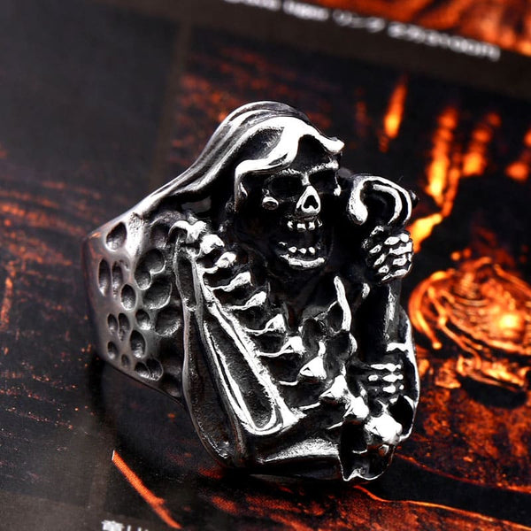 silver ring of the grim reaper holding a scythe