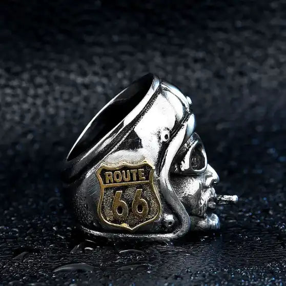 silver and gold ring of a biker wearing helmet with route 66 logo