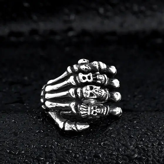 silver ring of skeleton hands