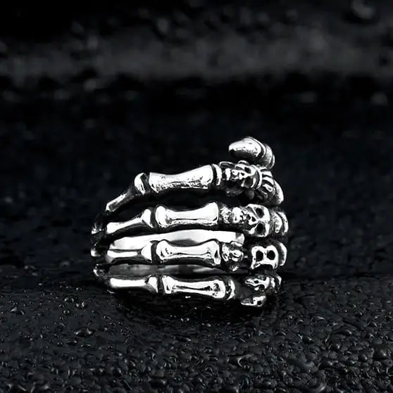 silver ring of skeleton hands