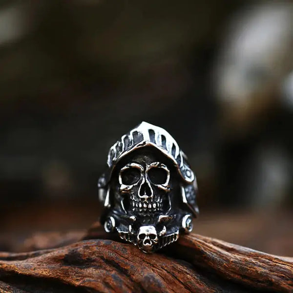 silver ring of a knight's skull and helmet armor