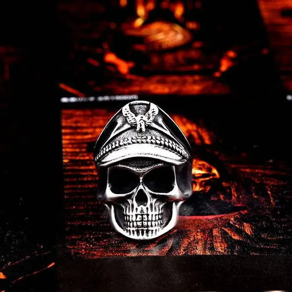 silver skull ring of a pilot wearing a military cover with an eagle