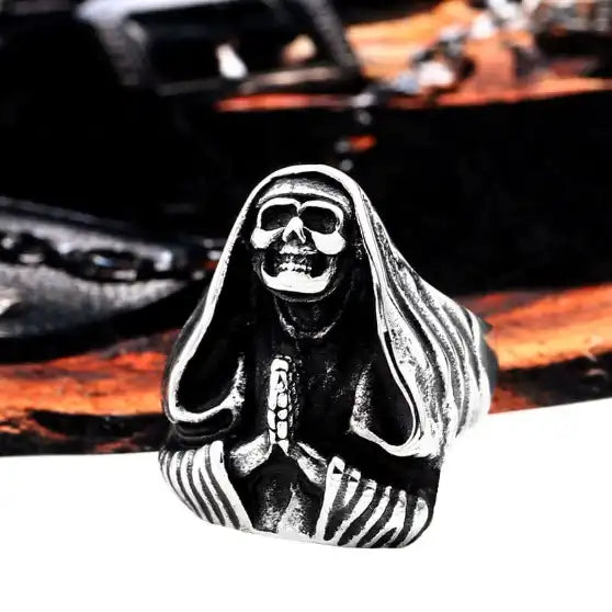 silver ring of unholy witch with prayer hands