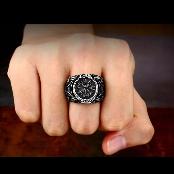 silver ring with vegvisir symbol on finger