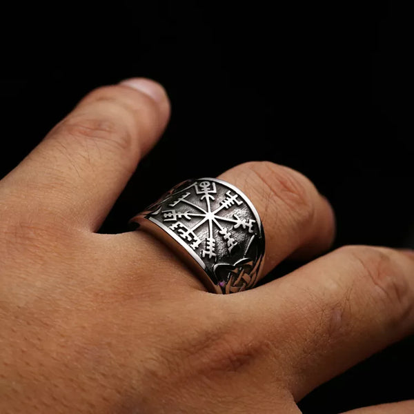 silver ring with vegvisir symbol and celtic knot on finger