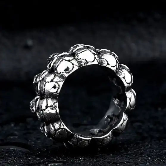 silver ring of stacked skulls