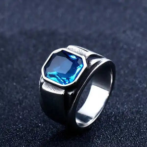 silver signet ring with eight sides and blue gem