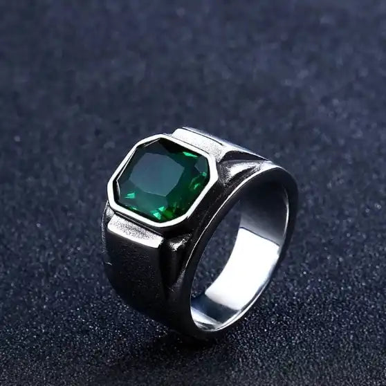 silver signet ring with eight sides and green gem